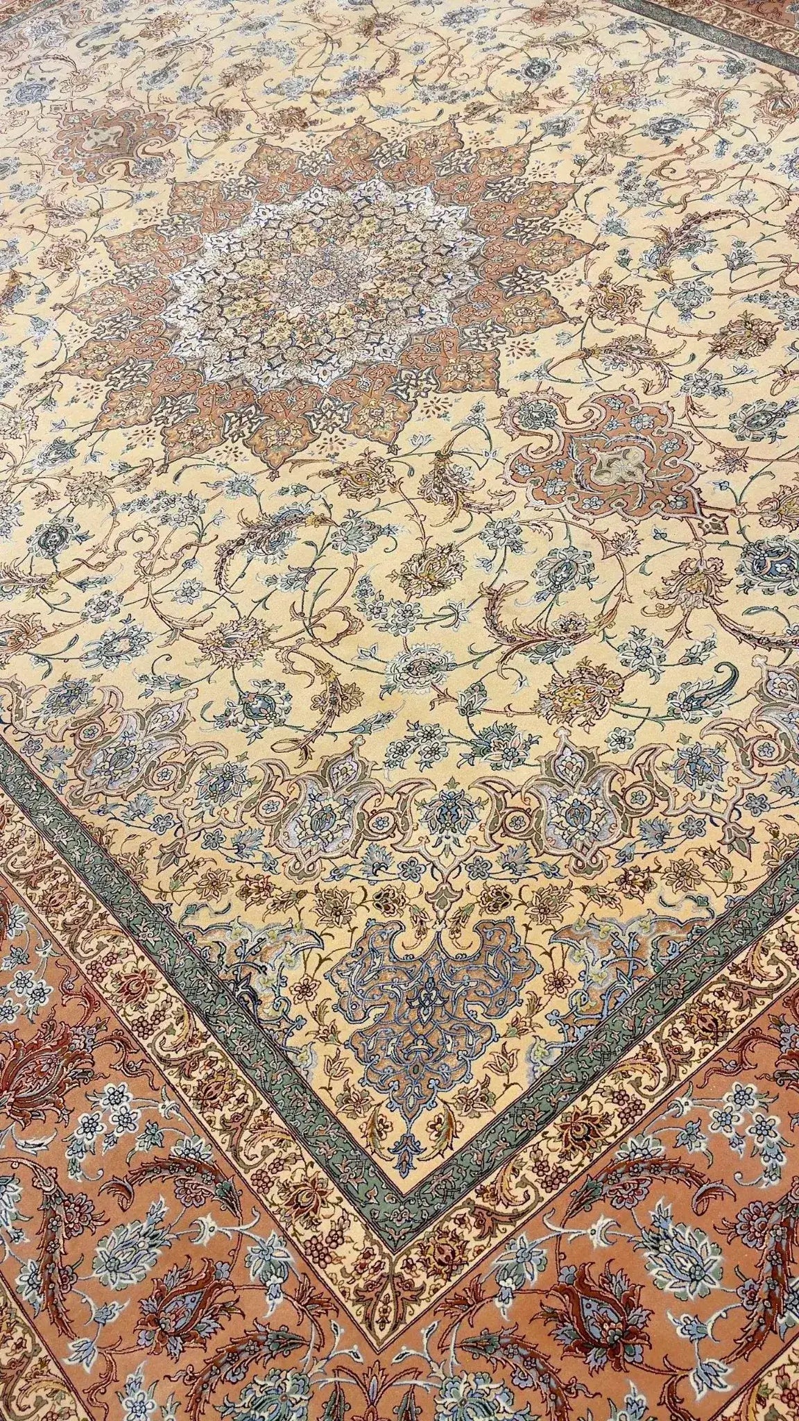 "Luxurious hand-knotted Persian rug with blue and rust accents, 810,000 knots"
